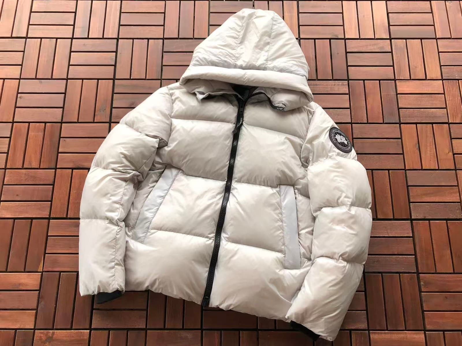 Off-white / black badge